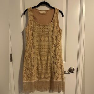 Adorable creamed peach cocktail dress with fridge. Extremely flattering